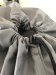 Closeup of Grey Polyester Laundry Bag Toggle Drawstring Closure
