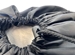Closeup of Slip lock Toggle Closure at the top of black Wash and Fold Duffel Laundry Bag