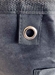 Closeup of One of Two Metal Grommets on Black Wash and Fold Duffel Laundry Bag 