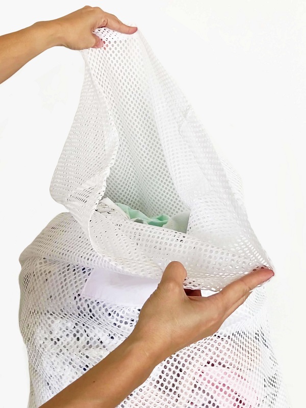 Open Top White Mesh Bag Cinched with a Cable Tie