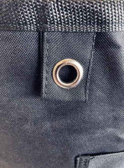 Closeup of One of Two Metal Grommets on Black Wash and Fold Duffel Laundry Bag