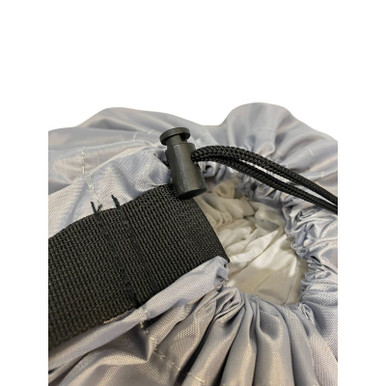 Closeup of toggle and carry strap on a large grey polyester laundry bag